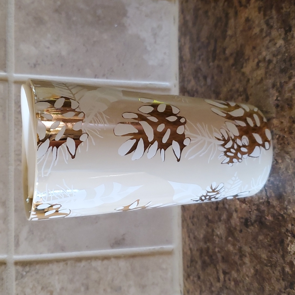 White and gold Starbucks travel mug, $15